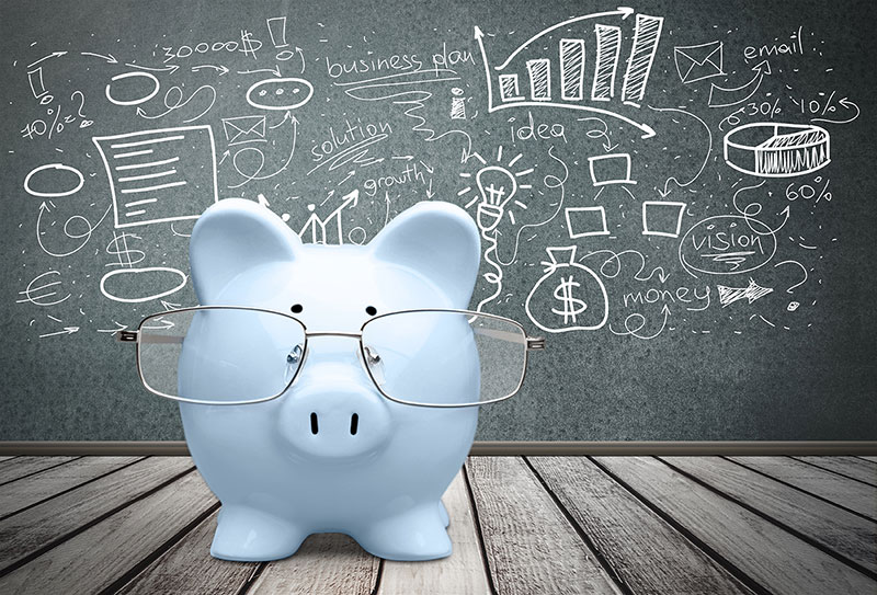 piggy bank with glasses and business figures behind