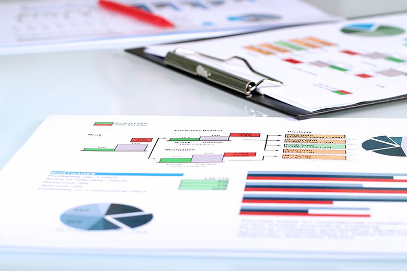 BI reporting figures on papers providing key financial insights