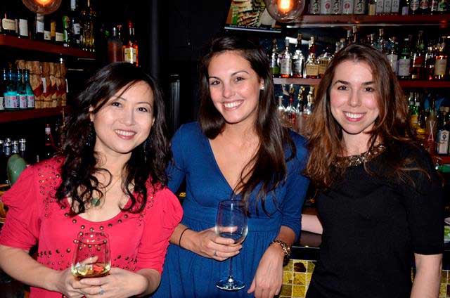 Women from Chateaux pose at a holiday party