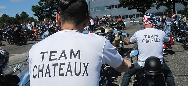 Team Chateaux on the back of tshirts worn by Chateaux staff members riding motorcycles