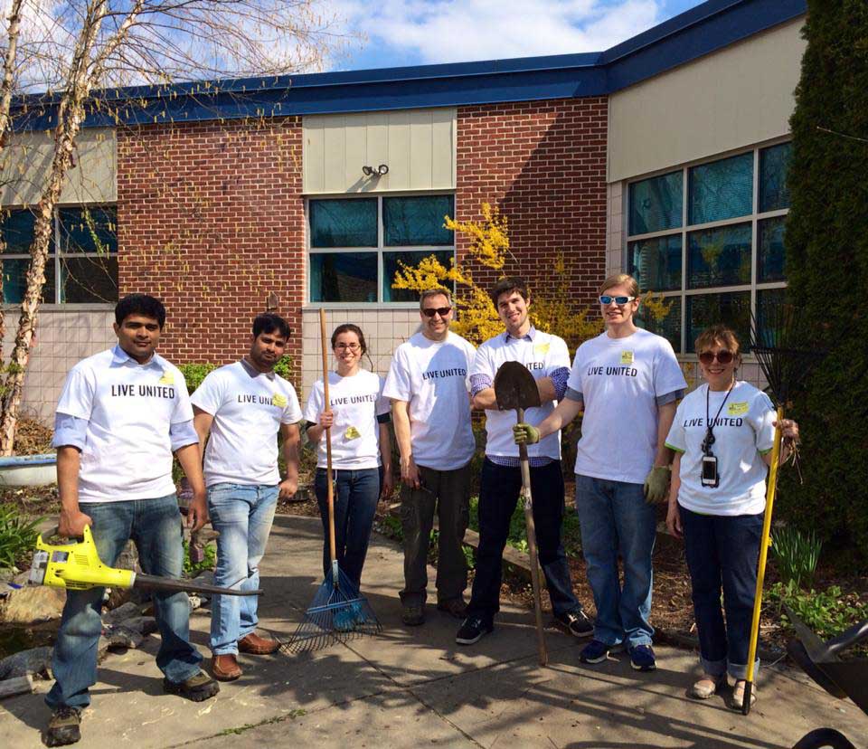 Chateaux team members volunteering through United Way at an elementary school garden