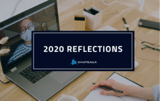 2020 Reflections from Chateaux - Worker at laptop with woman in facemask - 2020